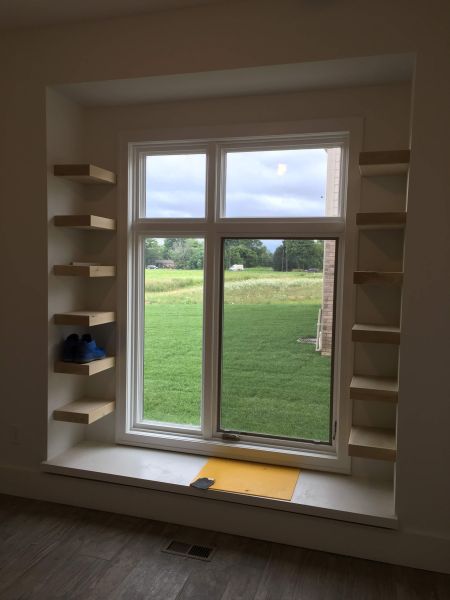 Custom bookshelves around a window