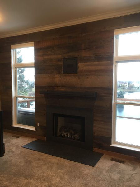 Custom mantle and backing using reclaimed wood