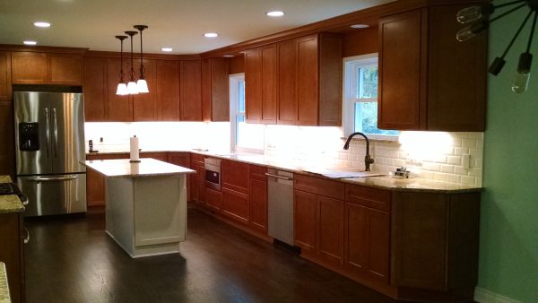 Kitchen remodel including cabinets, countertops, and lighting