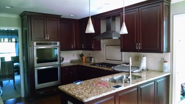 Kitchen remodel including cabinets, flooring, lighting, and countertops