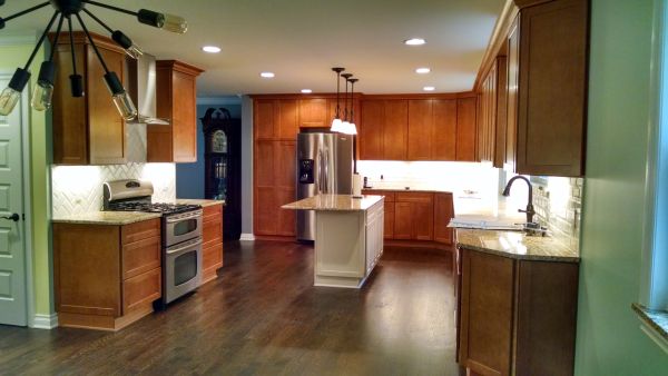 Kitchen remodel including cabinets, countertops, and lighting